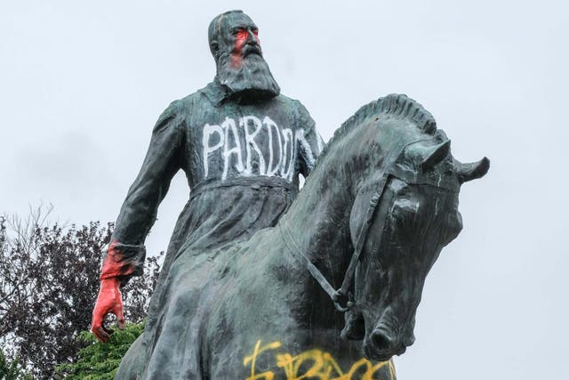 A statue of King Leopold II of Belgium daubed with graffiti in Brussels, Belgium