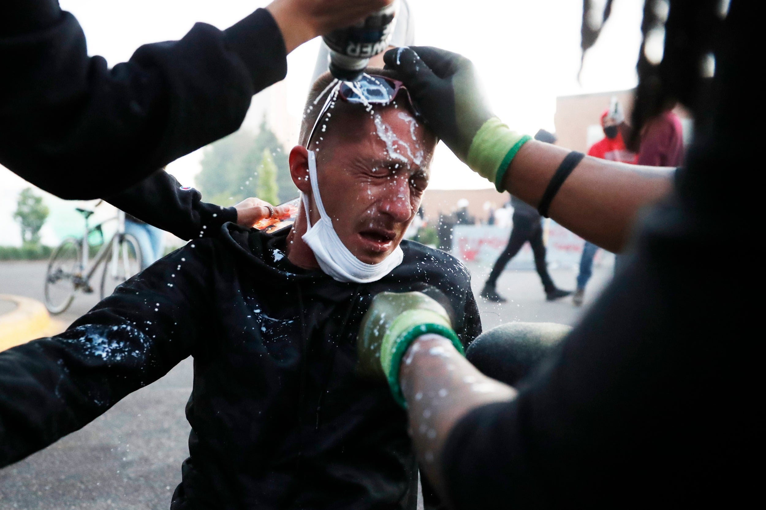 A protester has his eyes washed after being exposed to teargas in Minneapolis