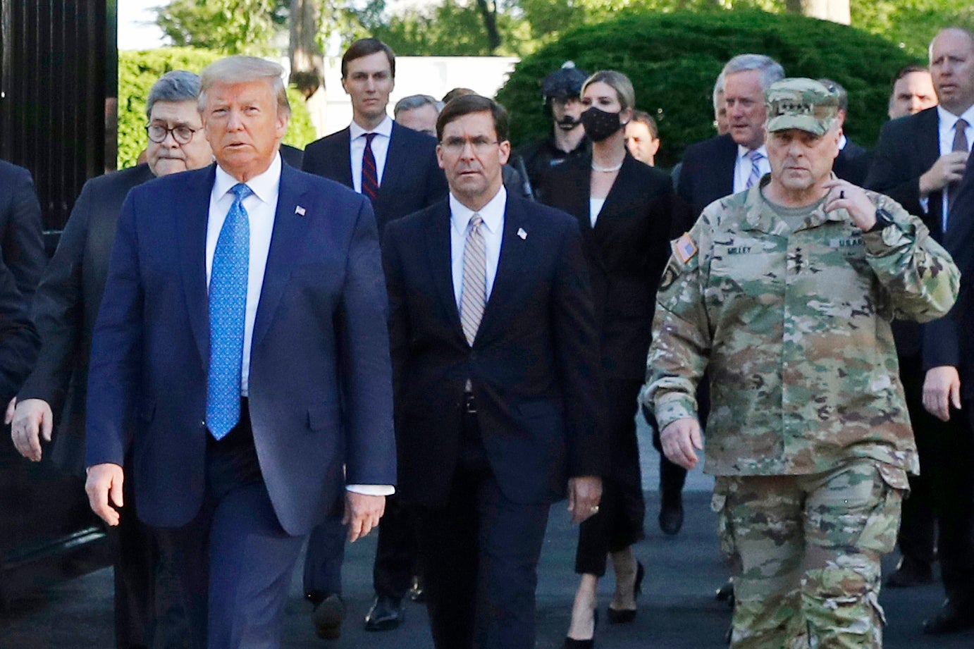 General Mark Milley (right) walks alongside the president on 1 June (AP/Patrick Semansky)