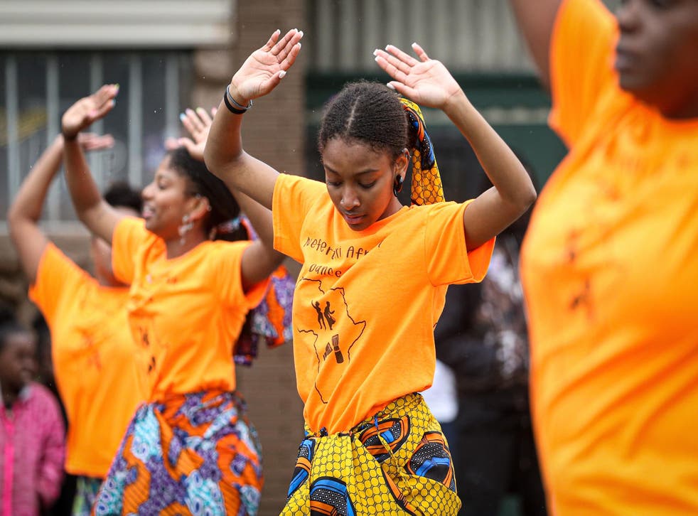 Members of a parade perform during the 48th Annual Juneteenth Day Festival in Milwaukee, Wisconsin.