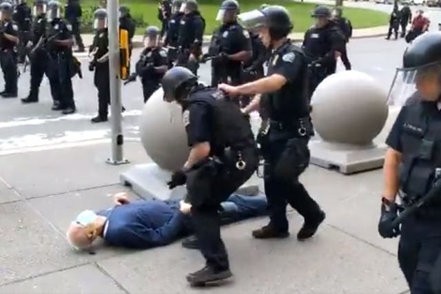 A still from the video of two Buffalo police officers shoving Martin Gugino to the ground