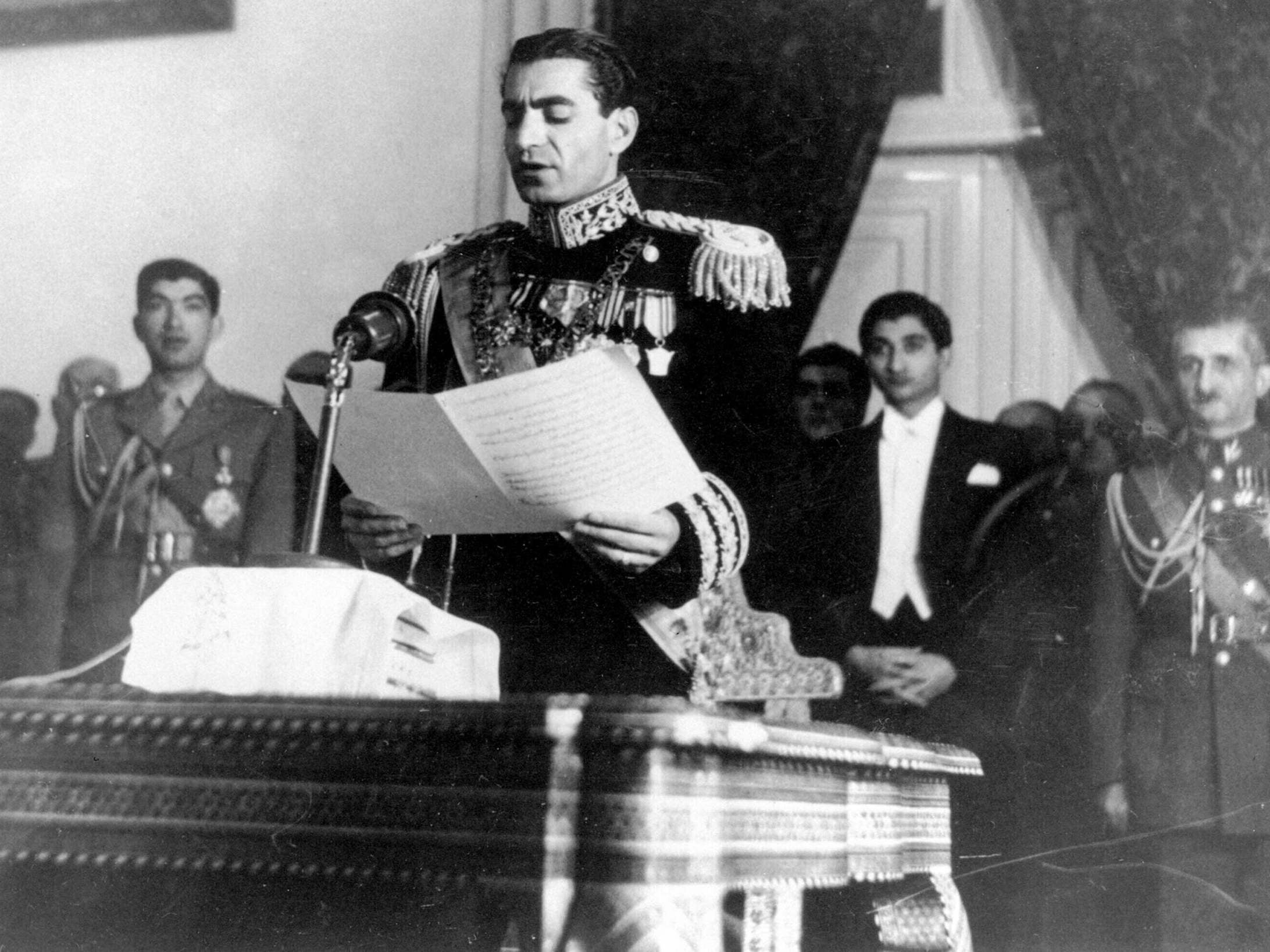 Shah of Iran Mohammad Reza Pahlavi reads his inaugural speech at the initial session of his nation’s first senate in Tehran, 16 February 1950