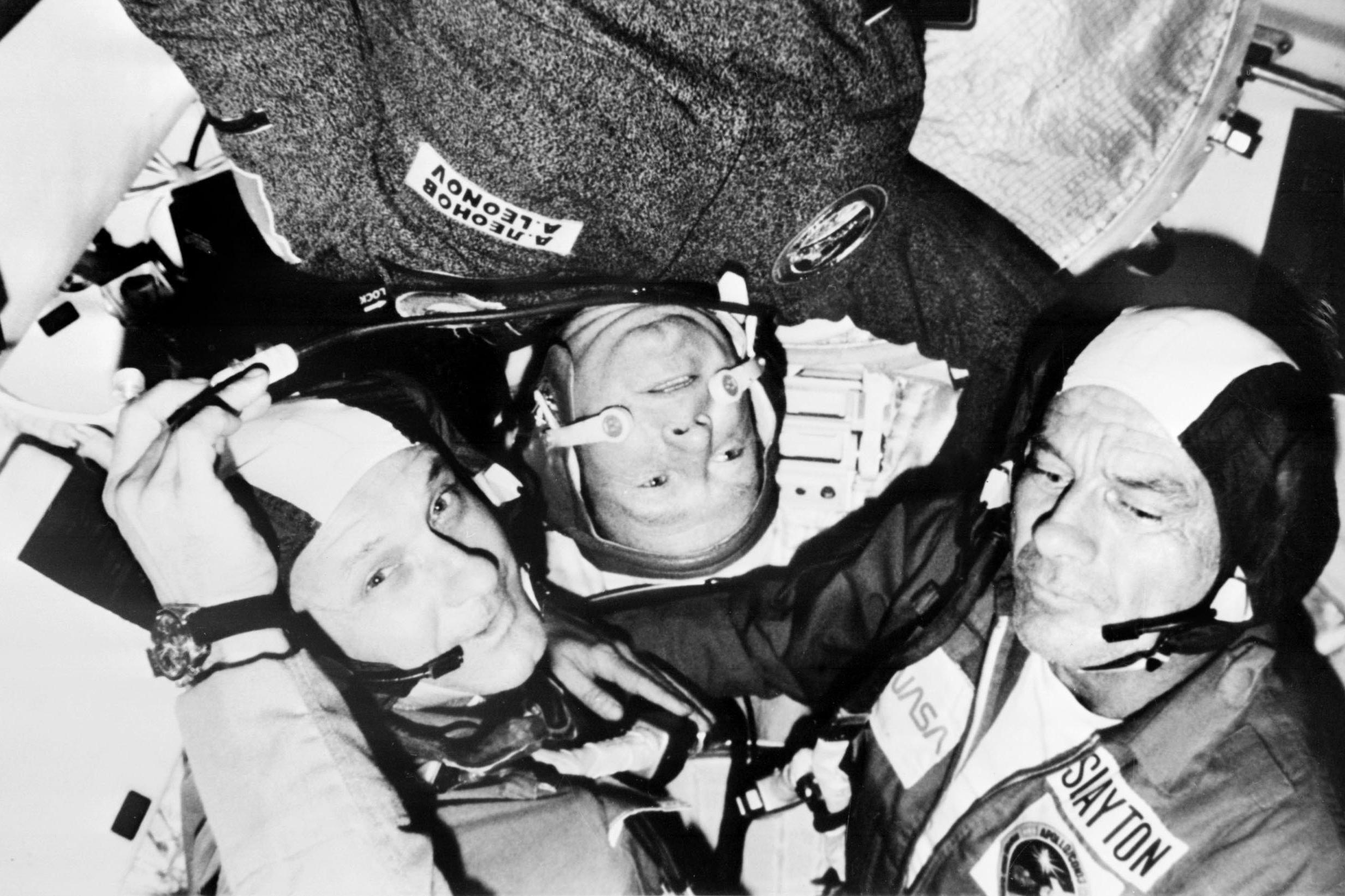 Leonov (centre) meets Thomas Stafford and Deke Slayton after arriving at the Apollo spaceship for the historic four-day joint spaceflight