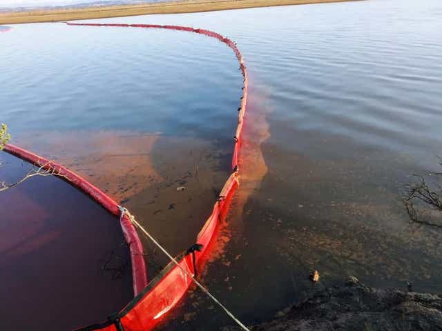 A containment boom tackles the oil spill in the Ambarnaya river outside of Norilsk