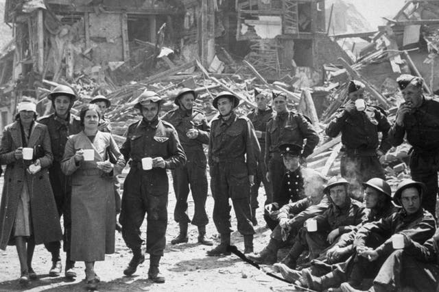 Locals who lost their homes after an air raid on Canterbury receive a helping hand from the army  