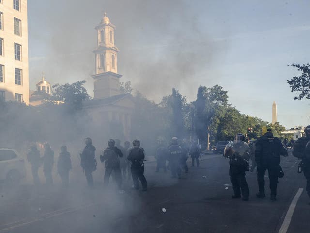 Police move demonstrators away from St John's Church across Lafayette Park from the White House, as they gather to protest the death of George Floyd in Washington