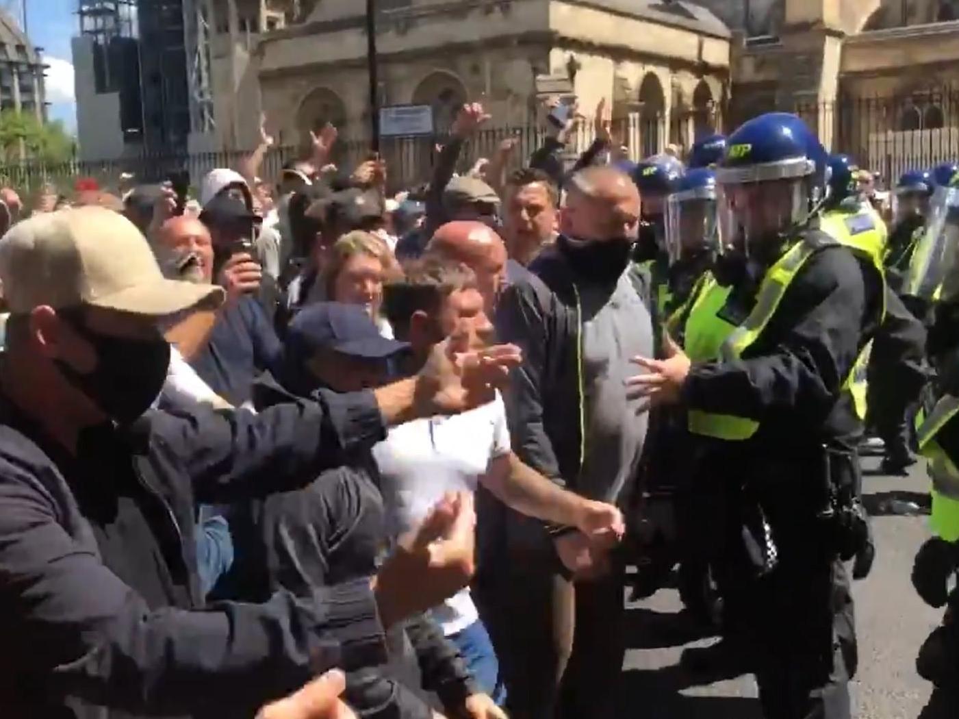 London protests: Demonstrators throw bottles and run into police as they 'defend' memorials