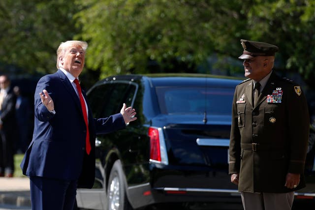 Donald Trump talks with Superintendent of the United States Military Academy Lt Gen. Darryl Williams as he arrives to speak to over 1,110 cadets in the Class of 2020 at a commencement ceremony at the United States Military Academy in West Point