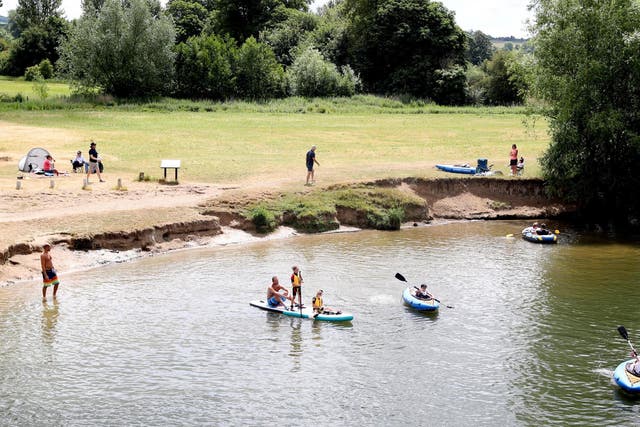 People enjoy the warm weather on the River Thames in Wallingford, England, on 13 June, 2020.