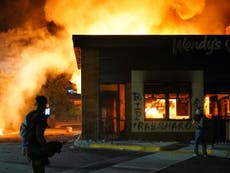 Protesters set fire to Atlanta restaurant after black man shot dead