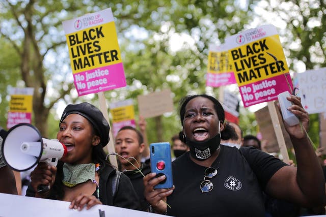 Anti-racism protesters attend a Black Lives Matter demonstration in London on 13 June 2020
