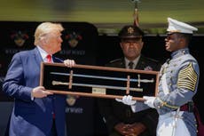 Trump blames 'slippery' ramp for awkward descent at West Point