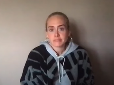 Adele holds back tears during emotional video for Grenfell anniversary