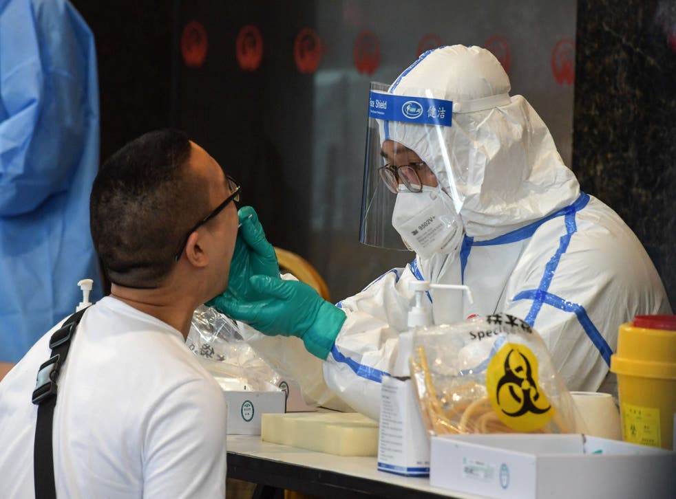 A man who visited Beijing recently is tested for the COVID-19 coronavirus in Nanjing in China's eastern Jiangsu province