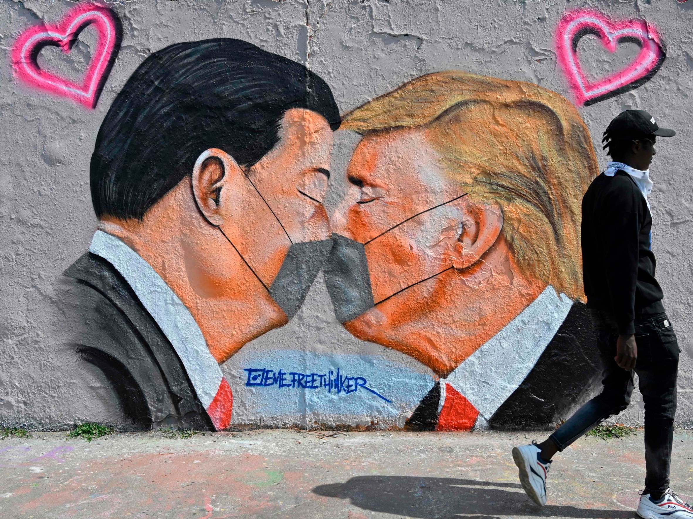 A graffiti mural of Donald Trump and Xi Jinping amid increased tension between China and the US over Covid-19