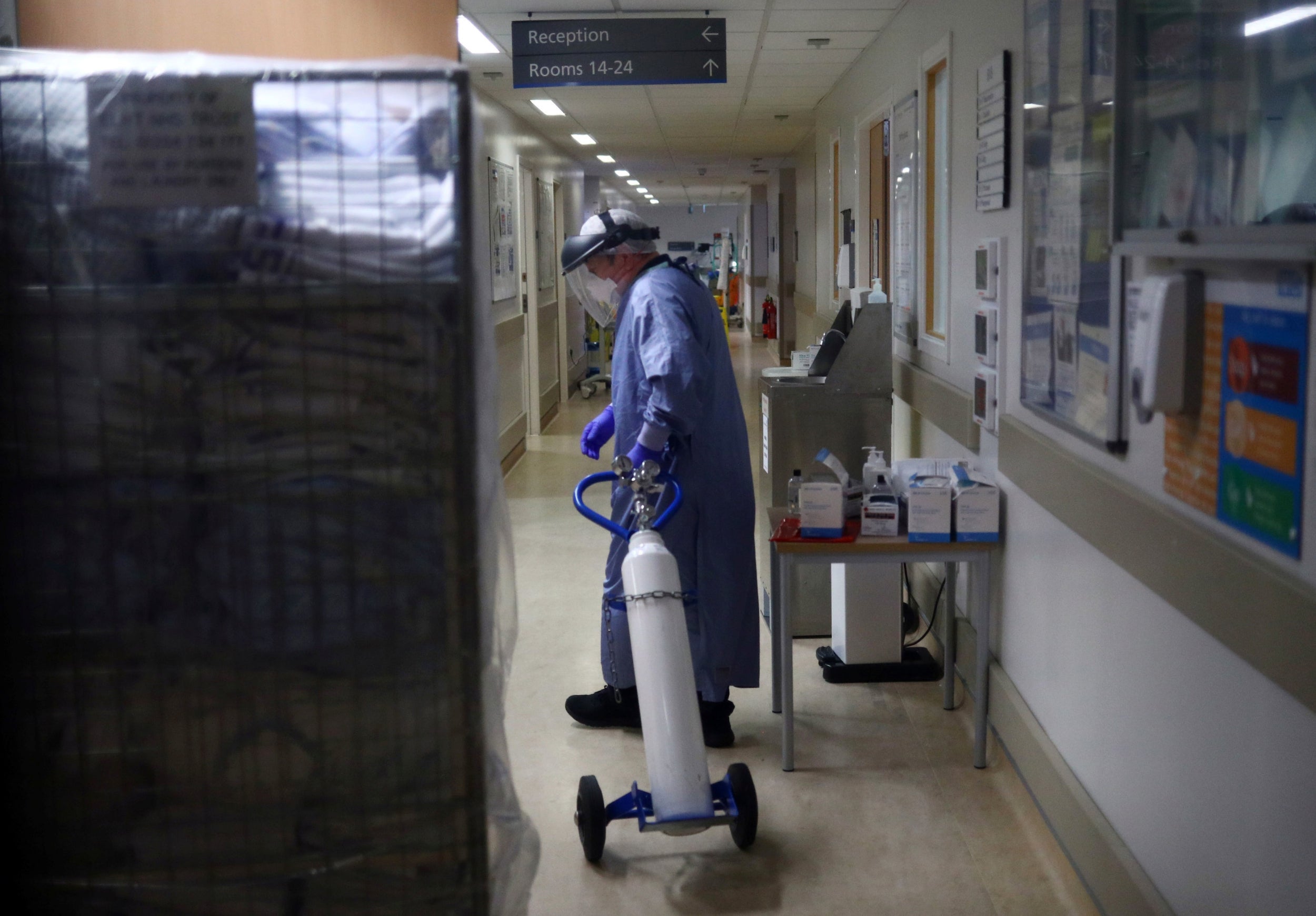 A medical worker moves an oxygen tank at a hospital in Lancashire