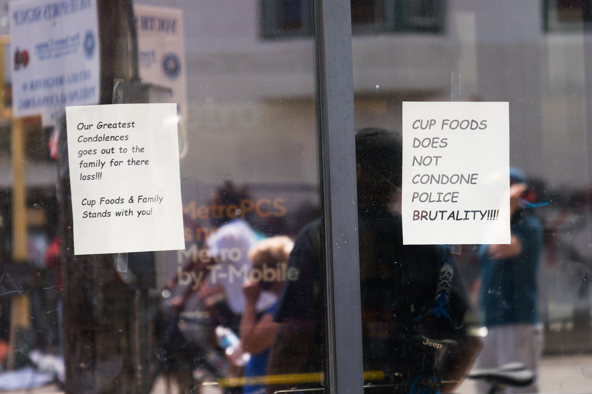 Signs have been posted in the doorway to Cup Foods reacting to Floyd's death (