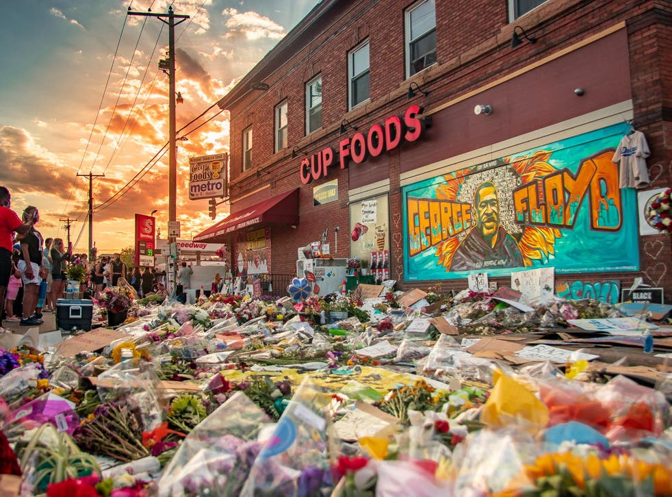 Protesters flocked to Cup Foods in the wake of Floyd's killing leaving flowers and painting a mural