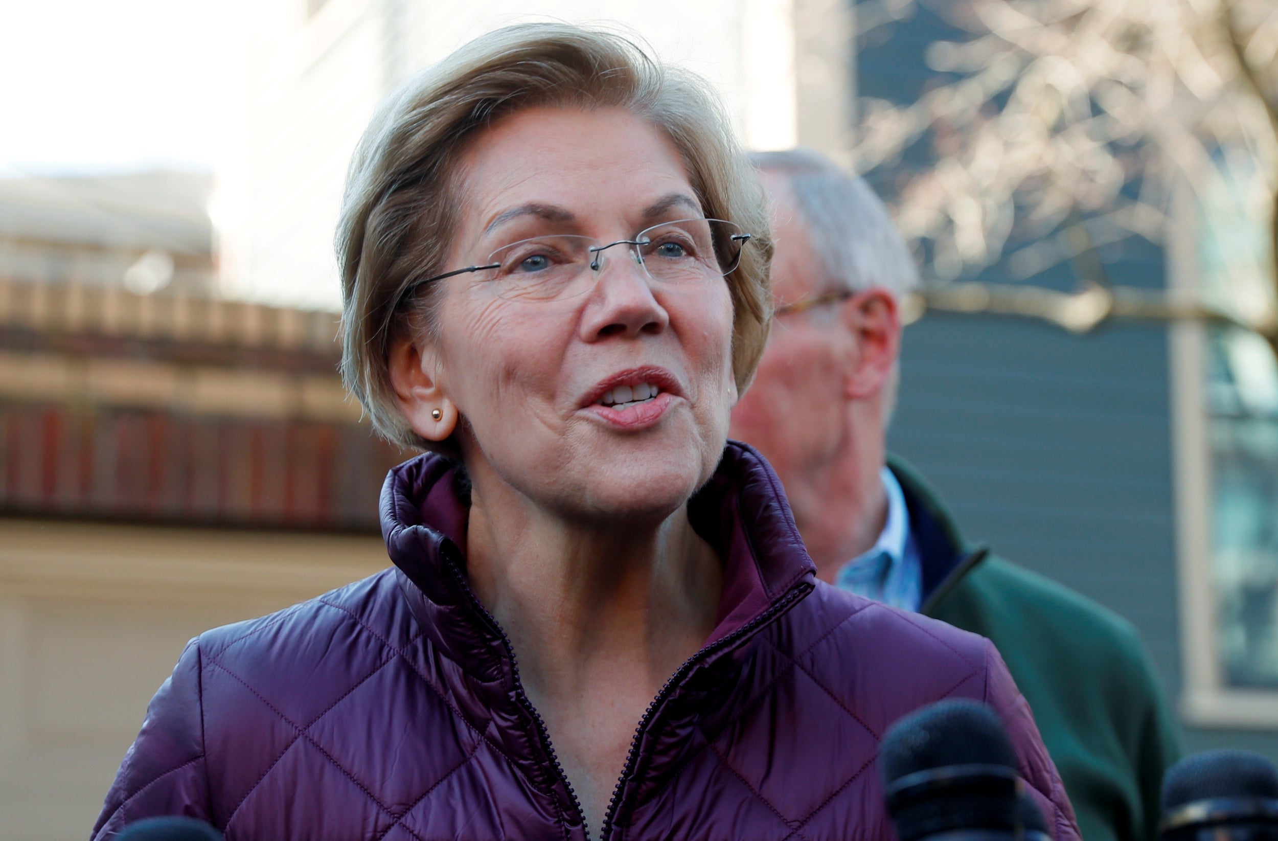 Elizabeth Warren talks to reporters outside her home in Cambridge, Massachusetts