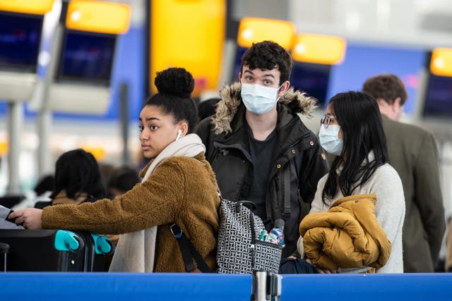 Passengers at Heathrow Airport, London, in March 2020