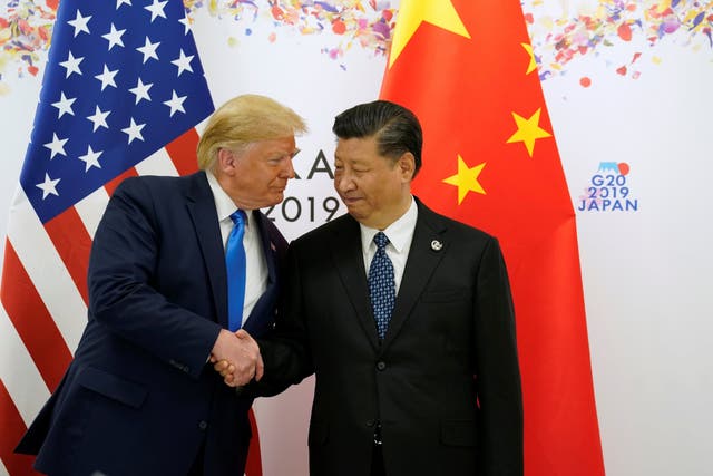 Donald Trump shakes hands with China's President Xi Jinping before starting their bilateral meeting during the G20 leaders summit in Osaka, Japan