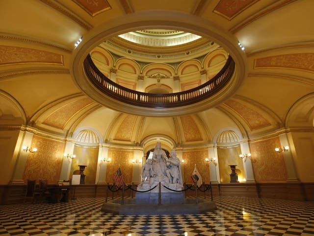 A statue of Queen Isabella and Christopher Columbus stands in the rotunda of the Capitol in Sacramento