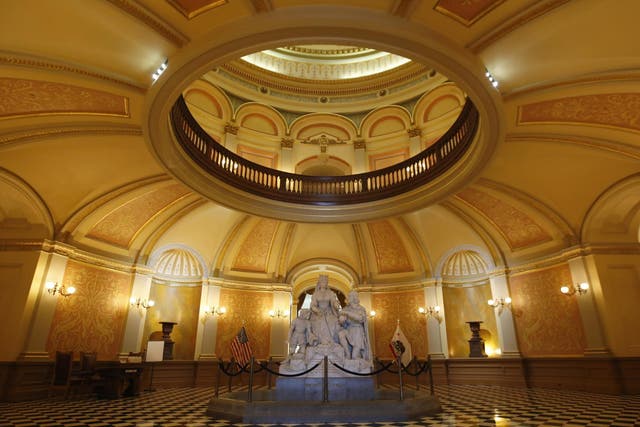 A statue of Queen Isabella and Christopher Columbus stands in the rotunda of the Capitol in Sacramento