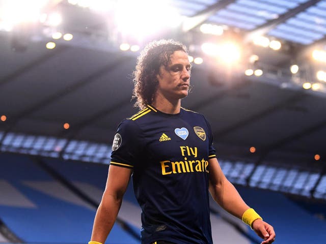 David Luiz walks off after a red card against City
