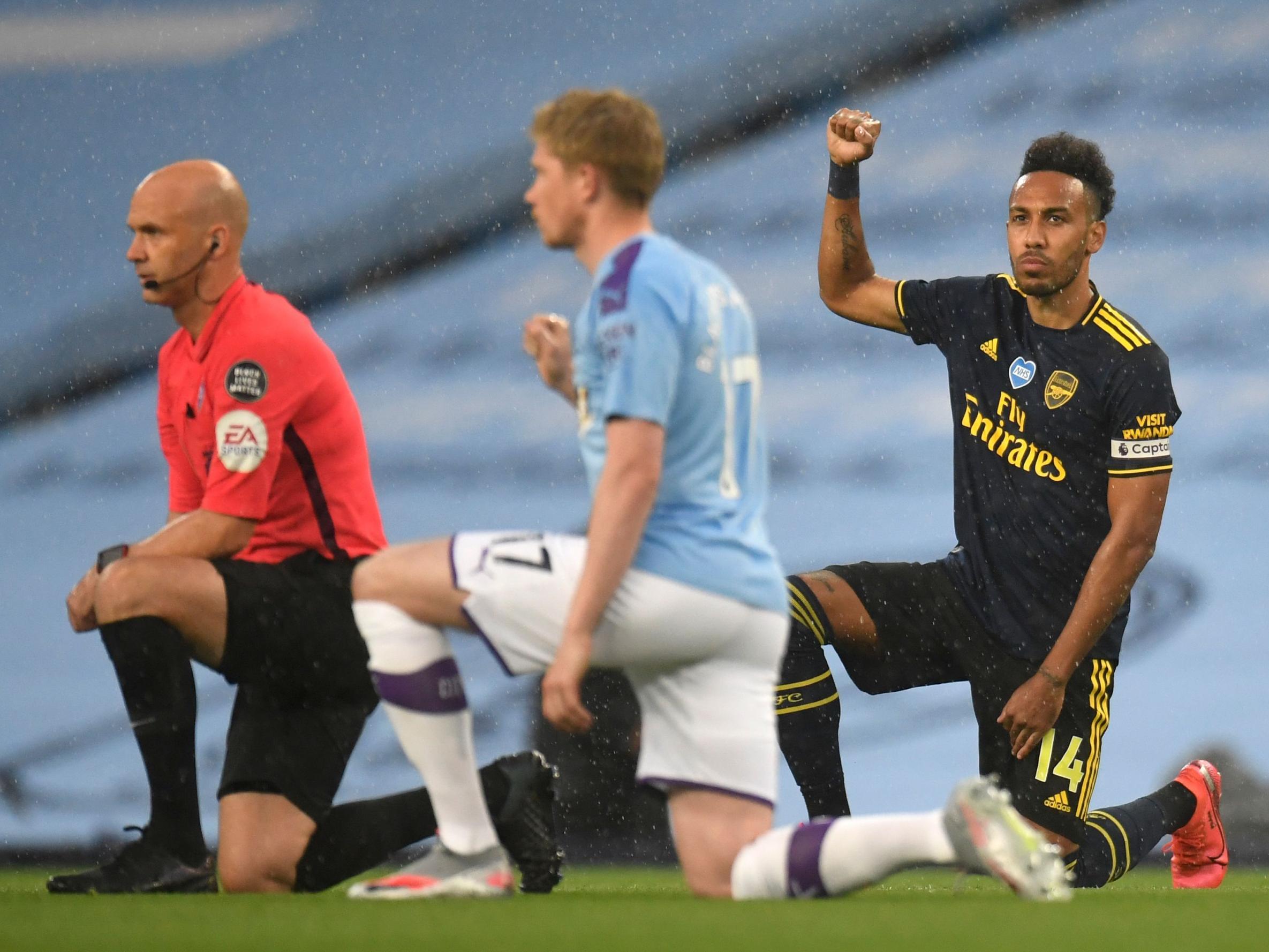 Players take a knee at the Etihad to show solidarity with the Black Lives Matter movement