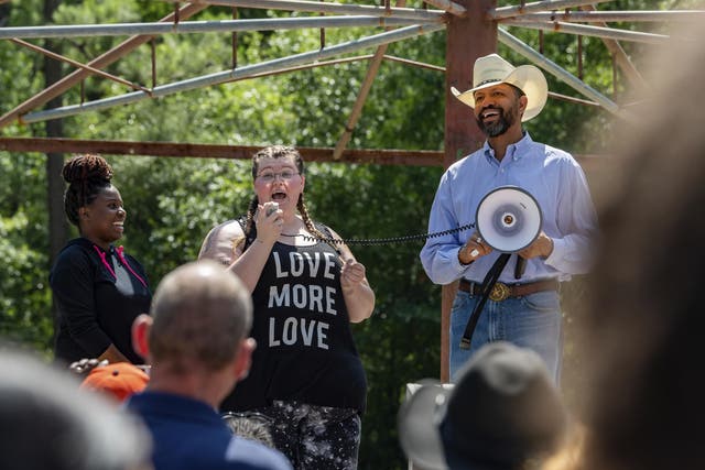 At a peace march in support of Black Lives Matter in Vidor, Texas, organisers Yalakesen Baaheth (left) and Madison Malone (centre) are joined on stage by Rev Michael Cooper of the local NAACP
