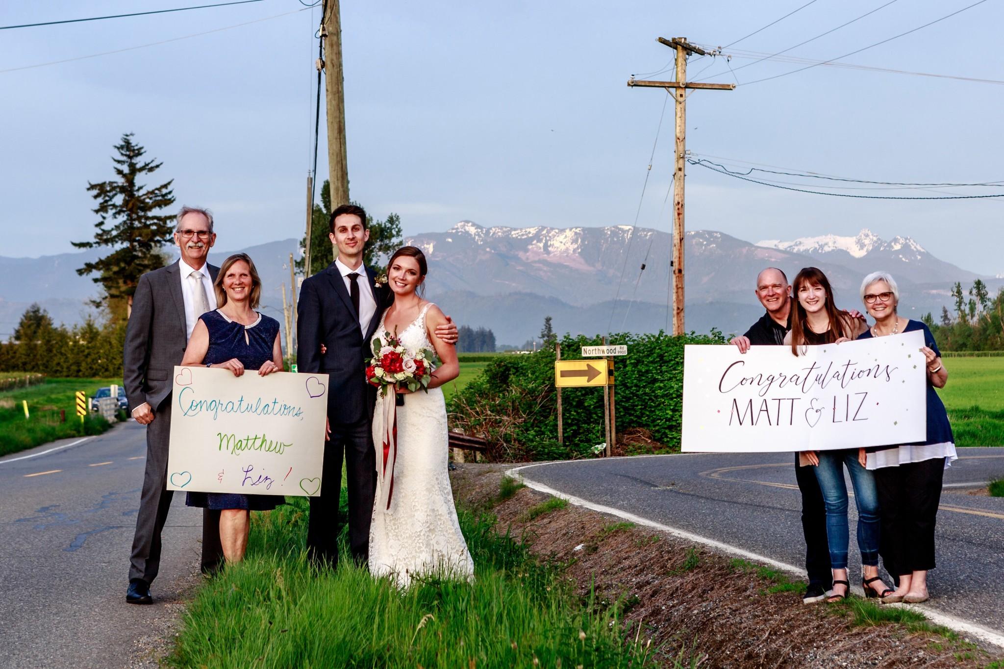 The families of Matt and Liz Peters stand at the US-Canada border to celebrate the couple's marriage