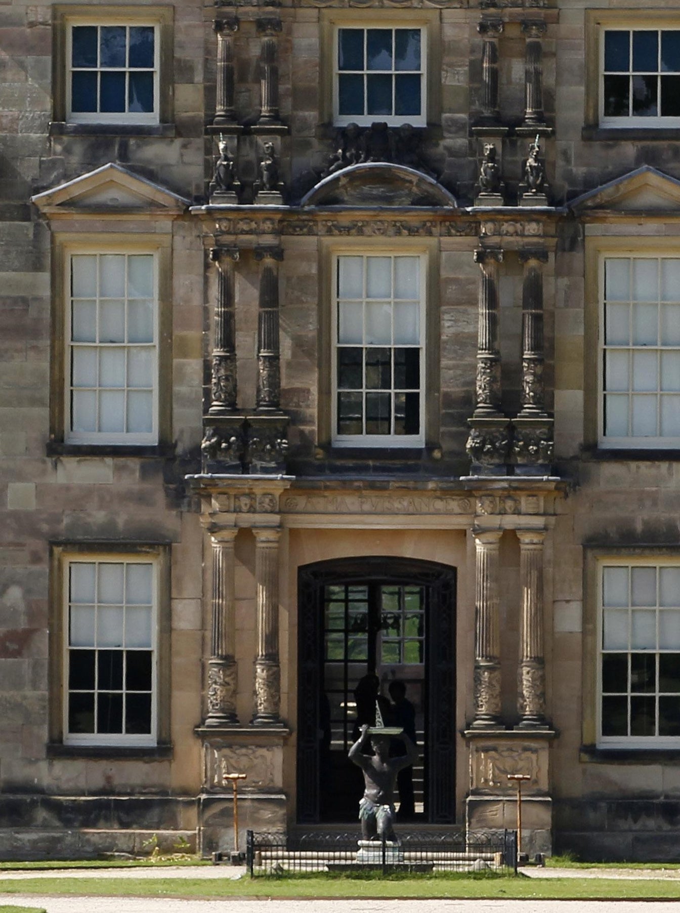 The National Trust has removed the figure of a black man with a sundial on his head from Dunham Massey in Cheshire because it caused 'upset and distress'