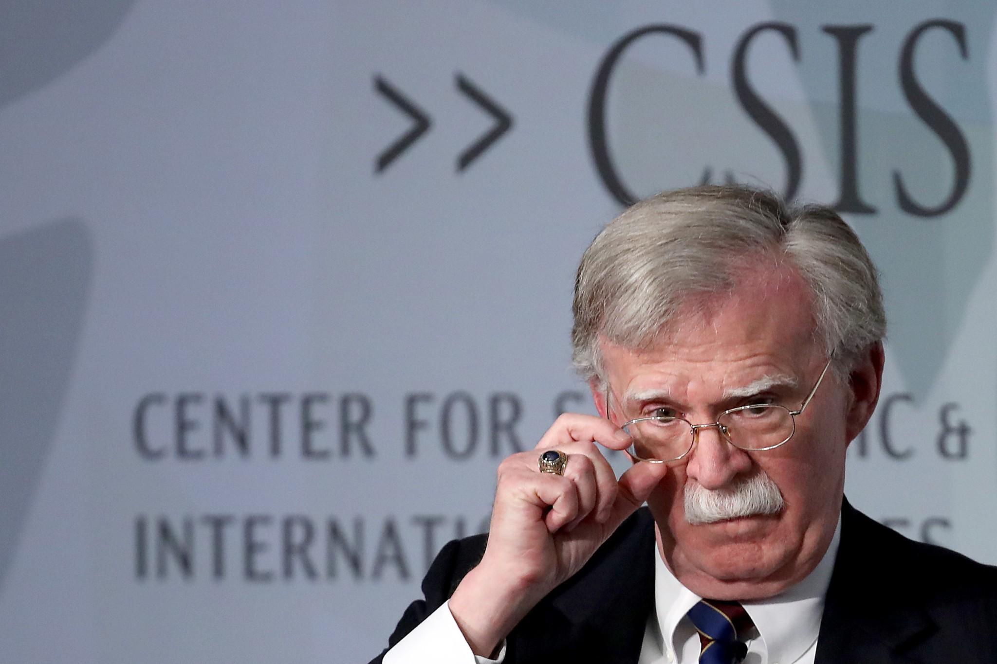 In his new book, Bolton says delay in releasing $400m in security assistance for Ukraine last summer was an attempt by Trump to get damaging material about Hillary Clinton and Joe Biden