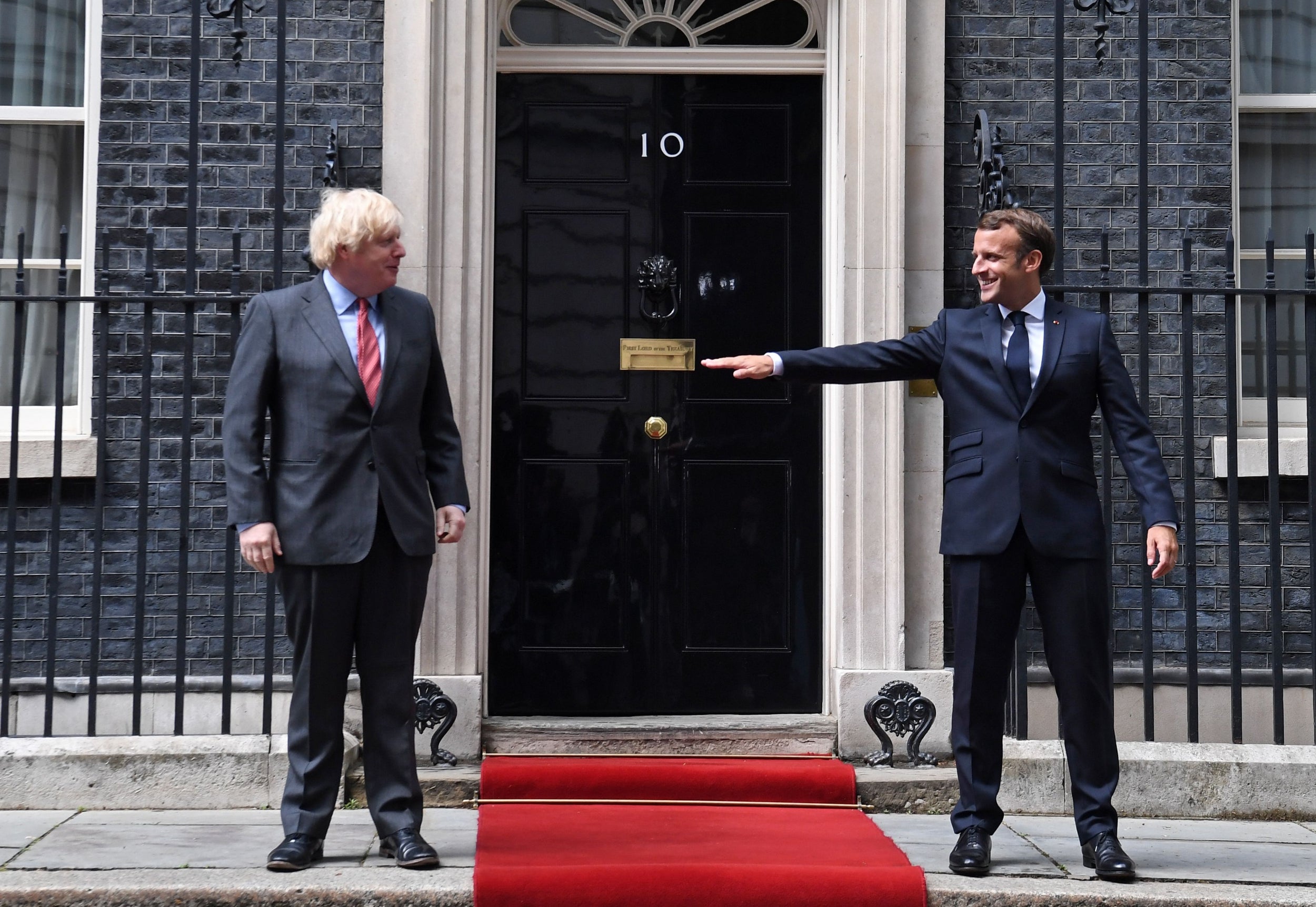 En garde: Boris Johnson hosted a (socially distanced) visit from Emmanuel Macron in June