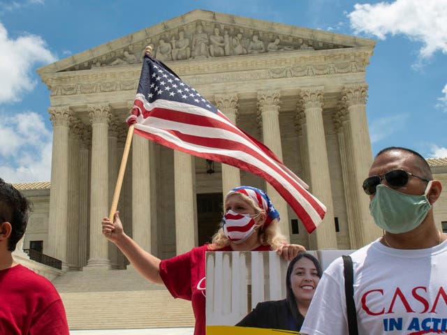 Ivania Castillo, a board member of CASA in Action in Prince William County (Virginia), waves a flag outside the Supreme Court building in Washington on Thursday, the day the court rejected the Trump administration's attempt to dismantle the DACA programme