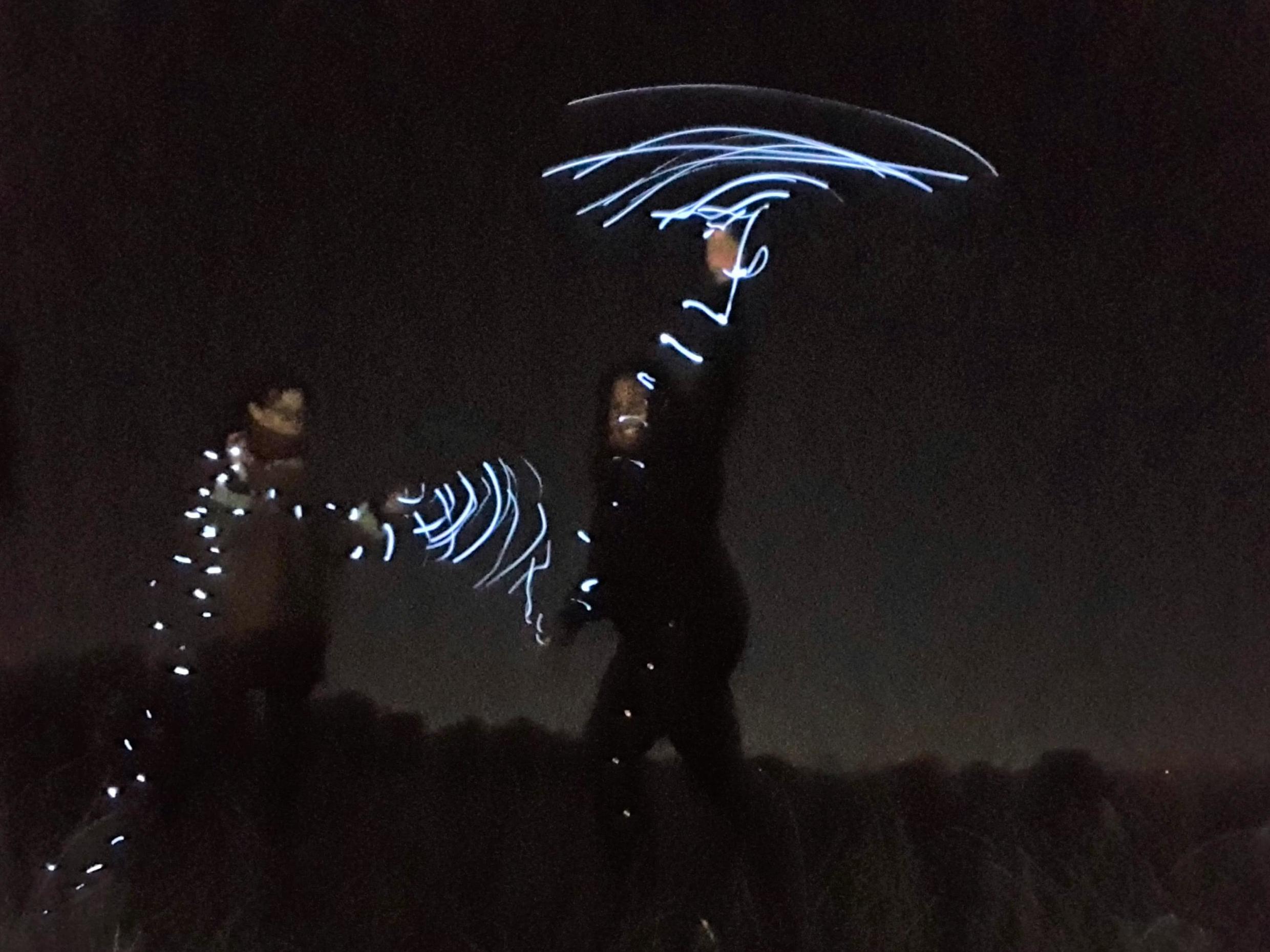 Nicole Smallman (left) and Bibaa Henry (right) are pictured dancing with fairy lights in Fryent Country Park, Wembley