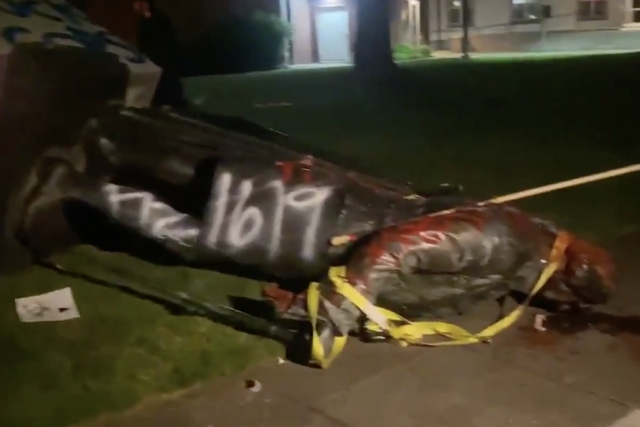 Protesters tore down the statue on Thursday evening, and it was covered with graffiti 