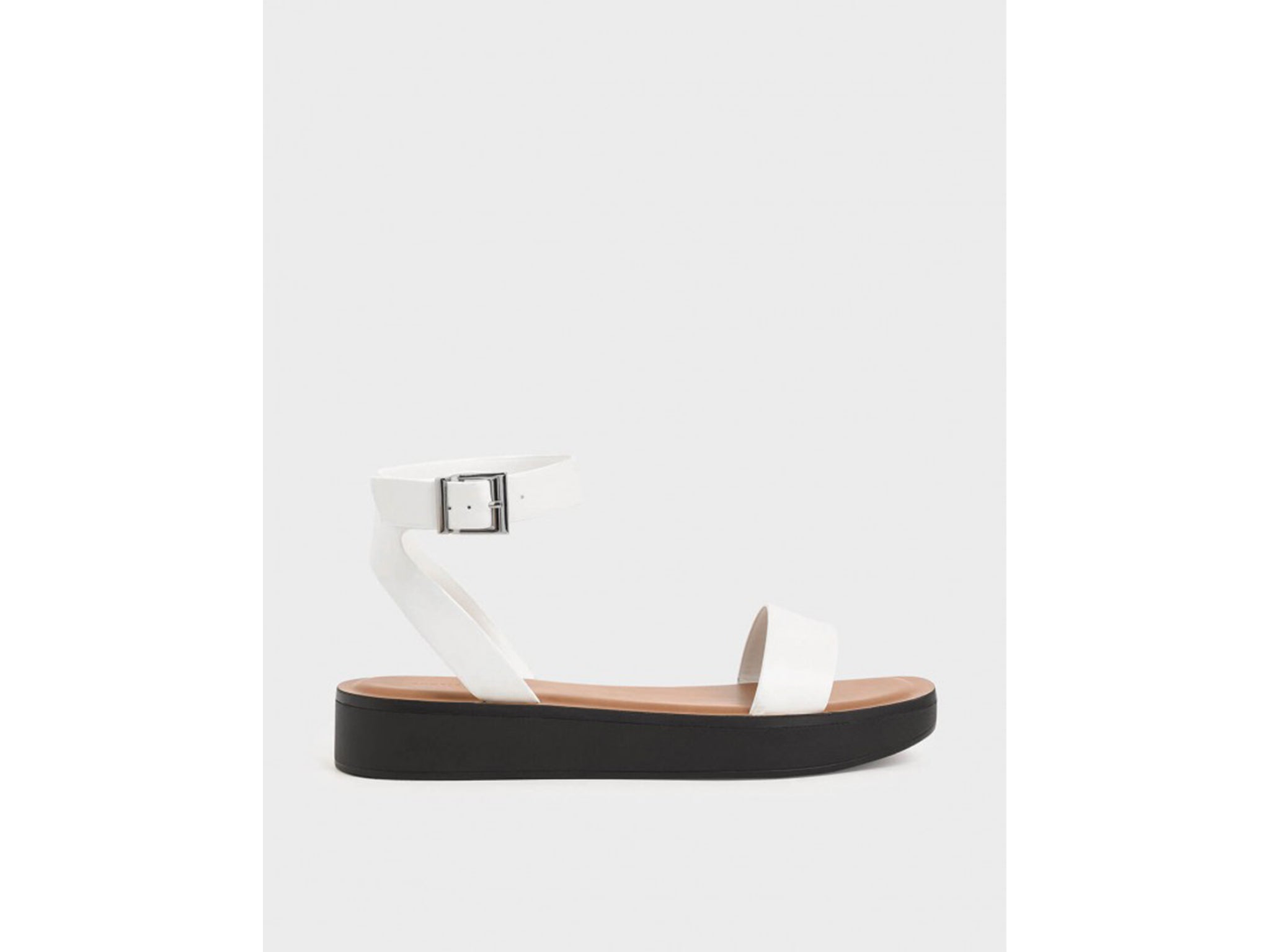 For added height, try these platform strappy sandals (Charles and Keith )