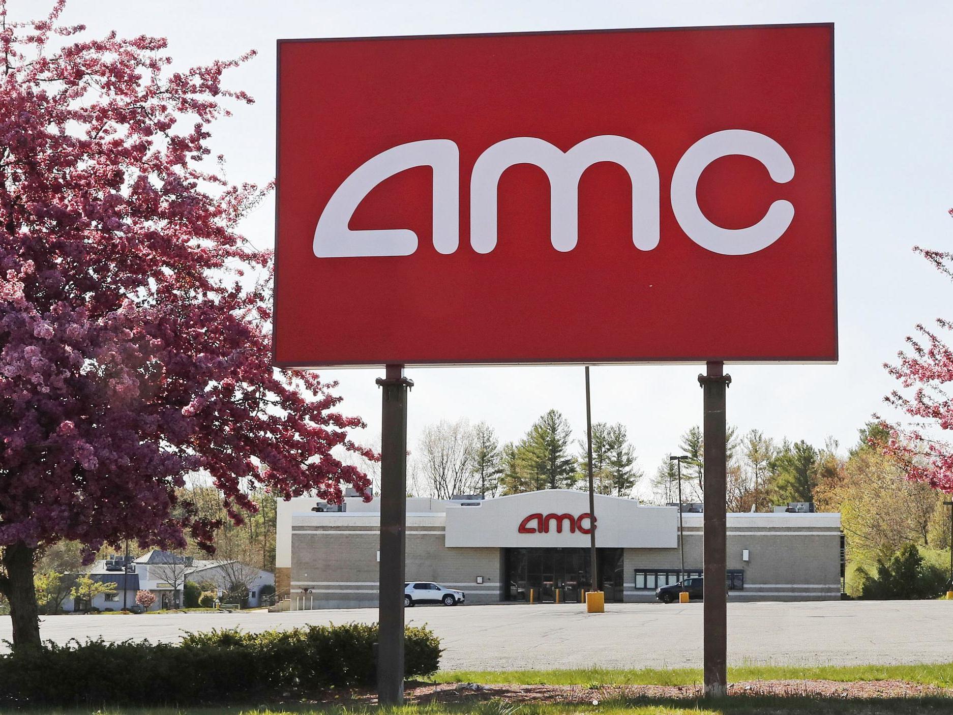 A AMC sign at a nearly empty parking lot for the theatre