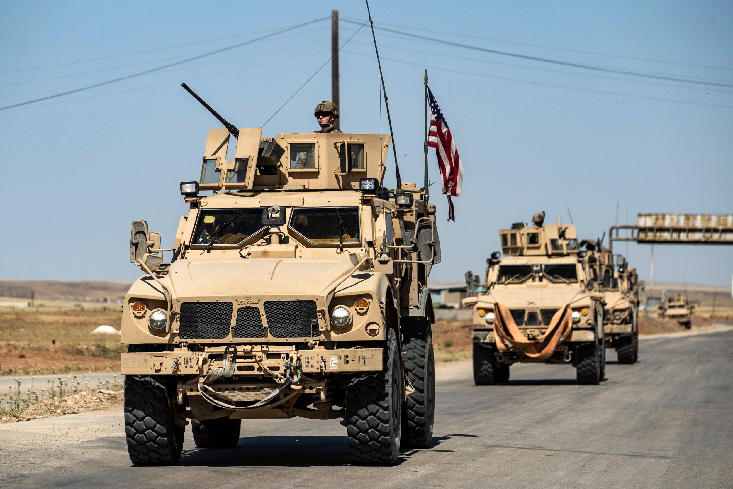 US military trucks like these, seen in Syria, have been outfitted for local law enforcement.