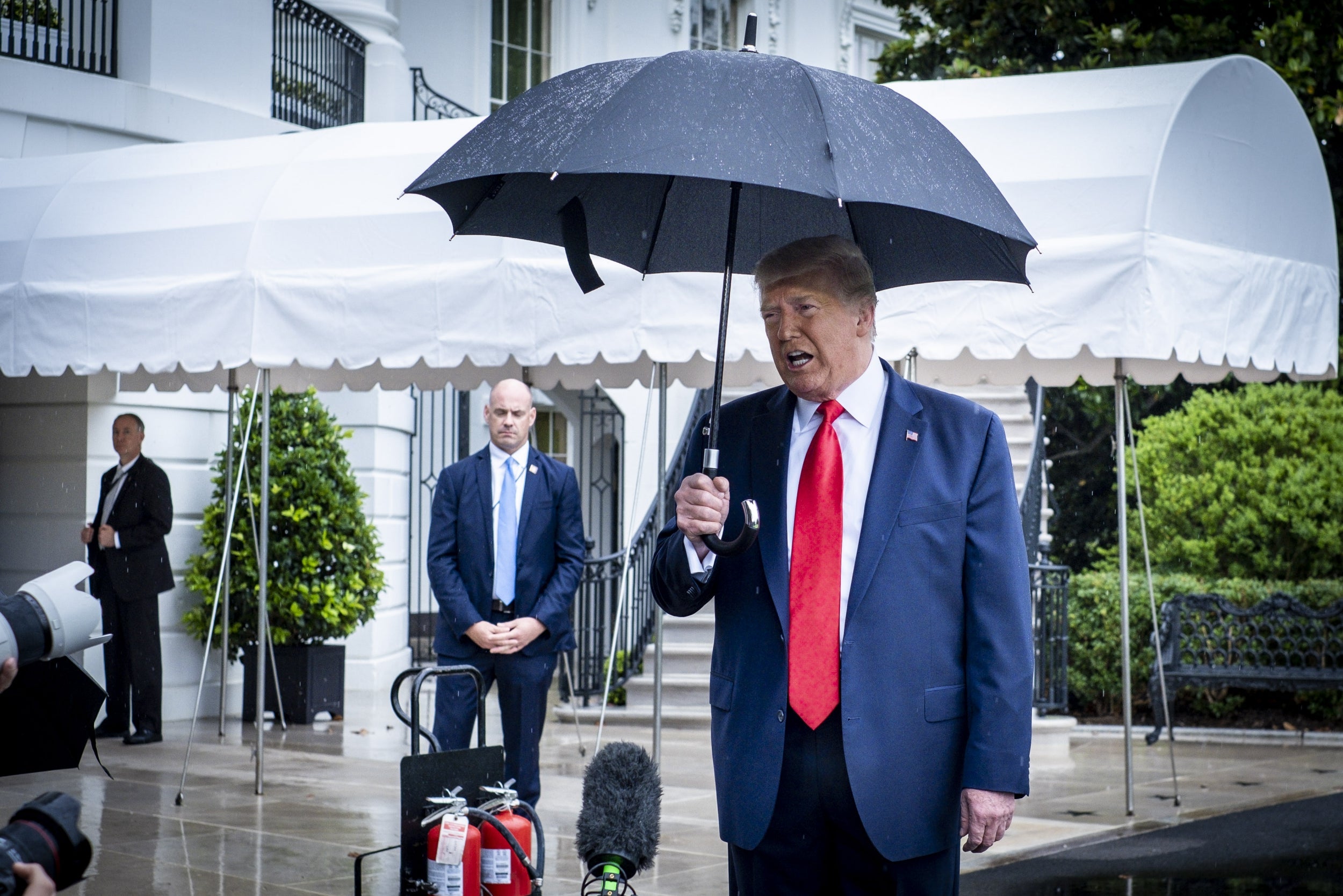Donald Trump speaks to reporters as he leaves the White House to travel to Tulsa, Oklahoma for his first rally in three months