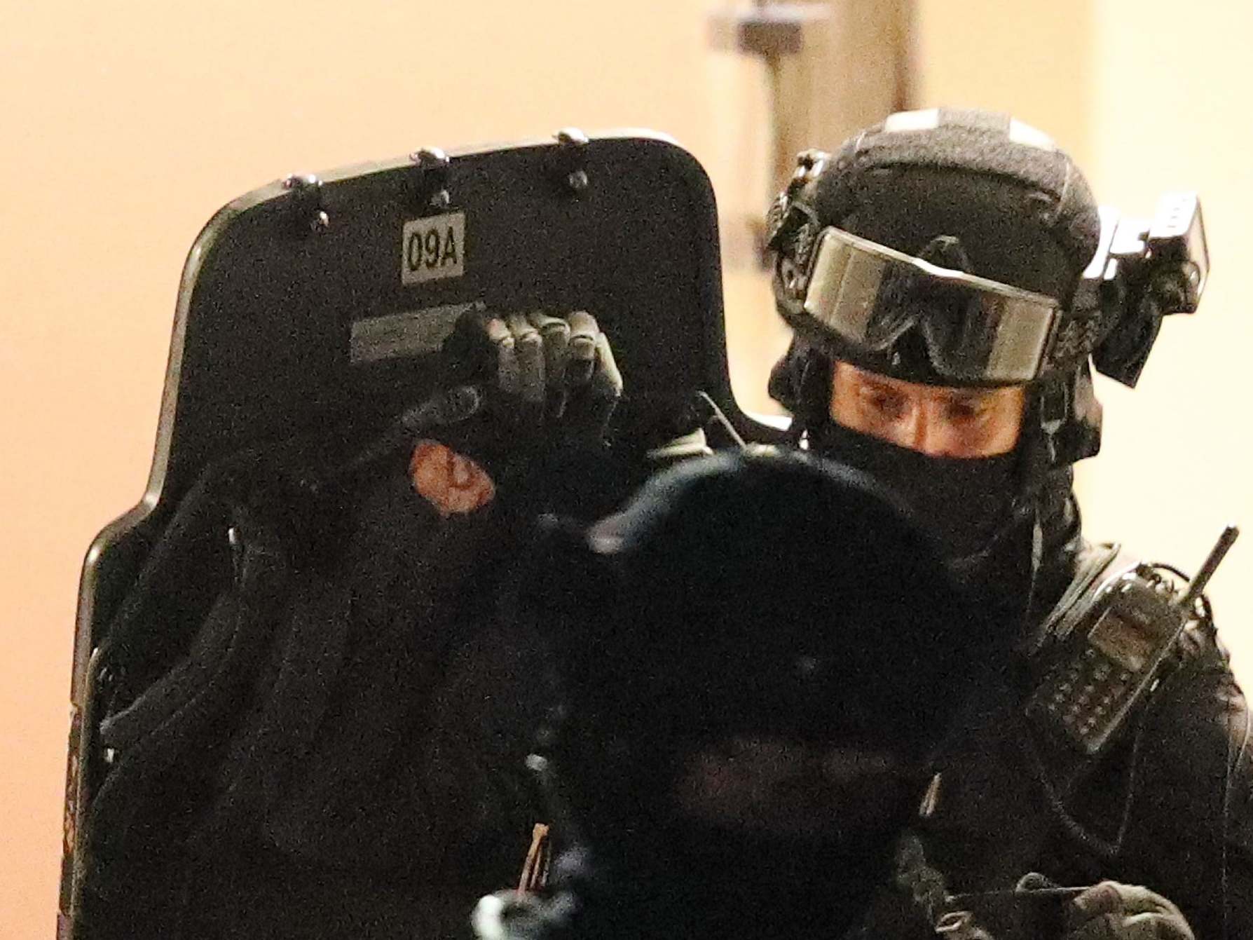 Armed police officers raid a block of flats in Reading following the incident