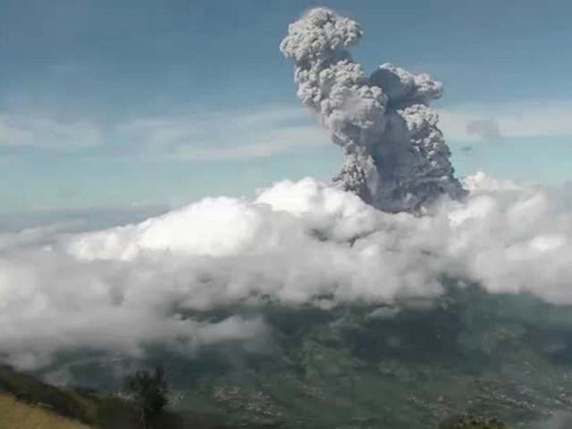 Mount Merapi volcano spewing thick smoke into the air as seen from Yogyakarta