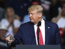 Trump cheered after drinking water with one hand at rally