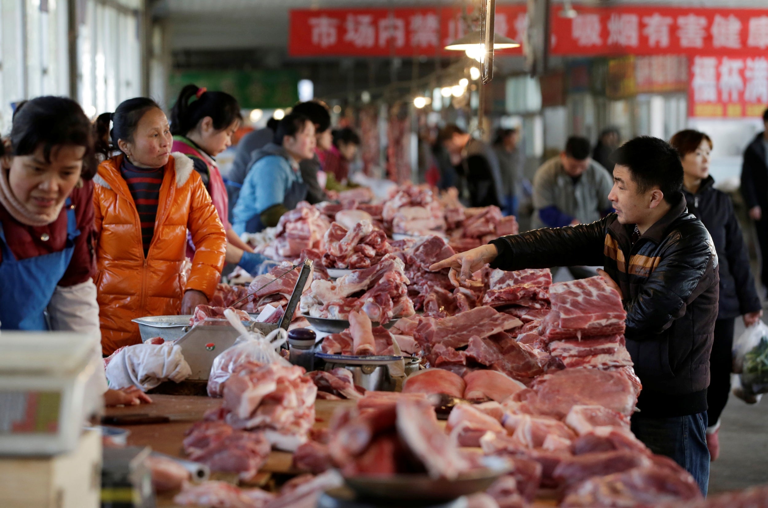 Meat stalls are seen at a market in Beijing, China