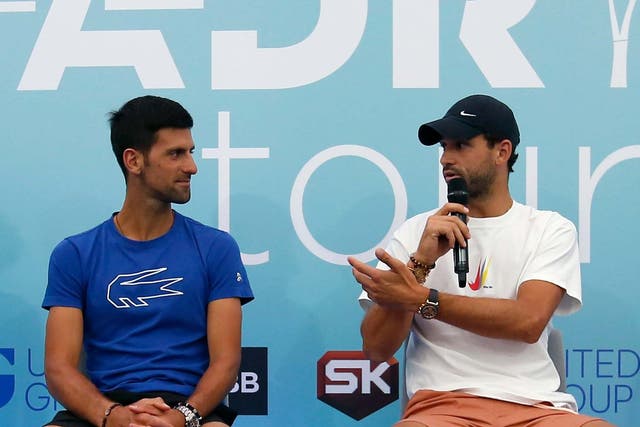 Novak Djokovic with Grigor Dimitrov on Friday, before the latter tested positive for coronavirus