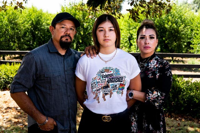 Black Lives Matter organiser Gisselle Quintero stands in Marysville, California, with her politically conservative parents, Wilfredo and Elizabeth, who support and respect her activism