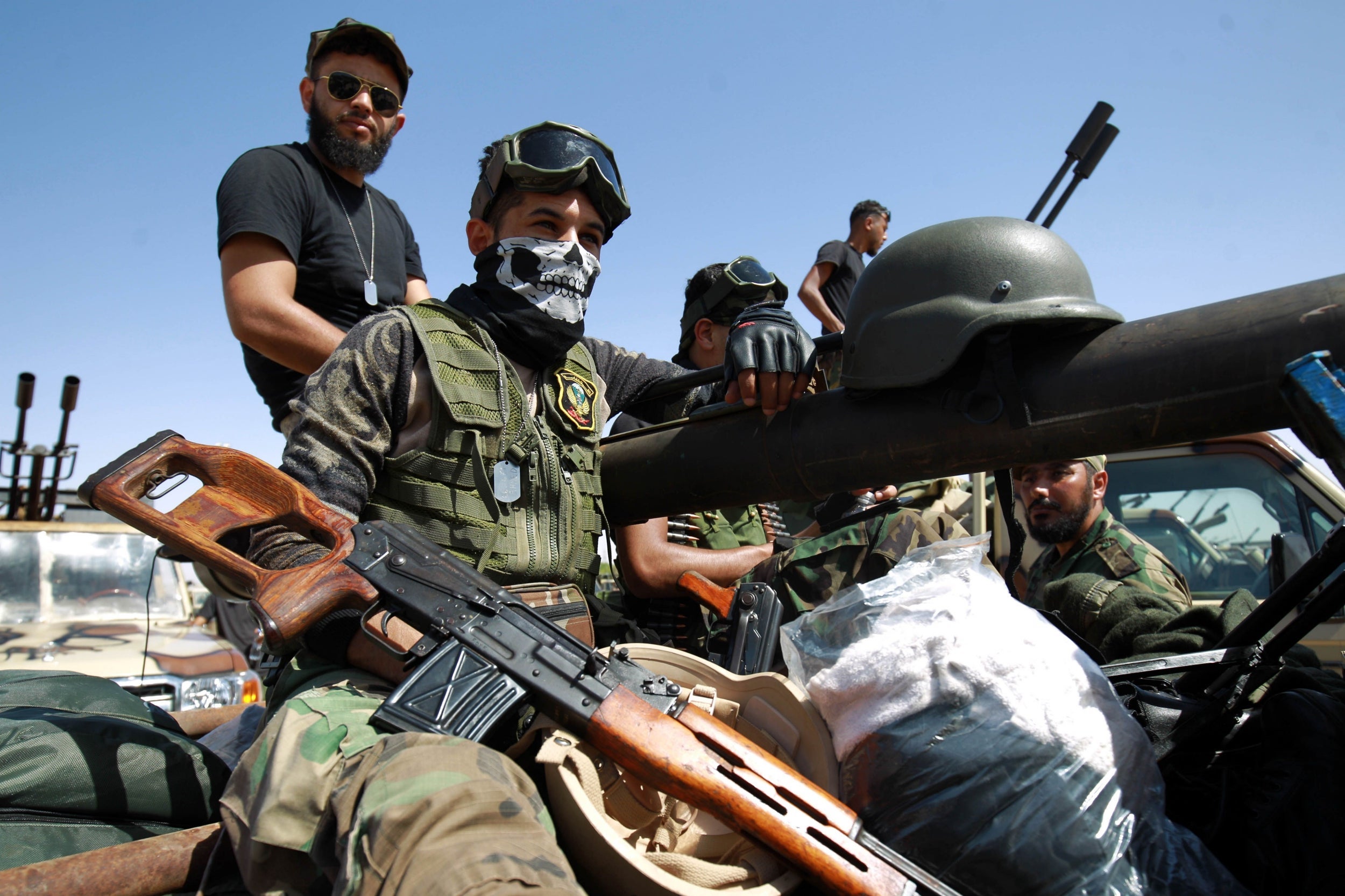 Members of the self-proclaimed eastern Libyan National Army (LNA) special forces, led by General Khalifa Haftar, gather in the city of Benghazi on their way to the frontline