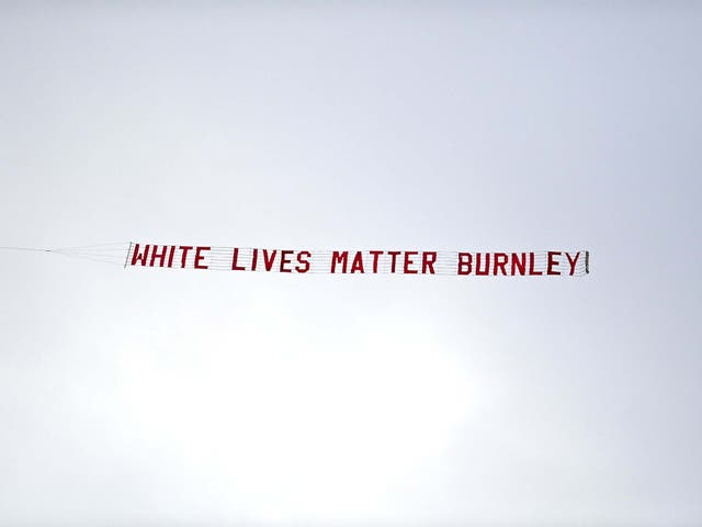 The banner is pictured flying above the Etihad Stadium