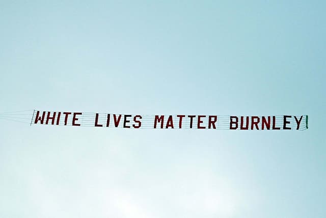A message reading 'White Lives Matter Burnley' is flown over the Etihad Stadium